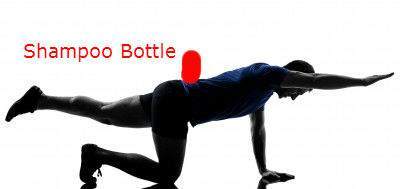 Bird dog exercise with a shampoo bottle to improve stability, blanace and strength assoicated with lower back pain.